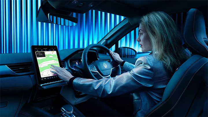 Interior shot of a woman using the openR link multimedia system on a Renault Symbioz