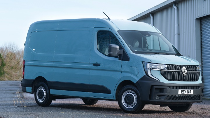 Renault Master E‑Tech electric van shown from a front three‑quarter angle outside an industrial building