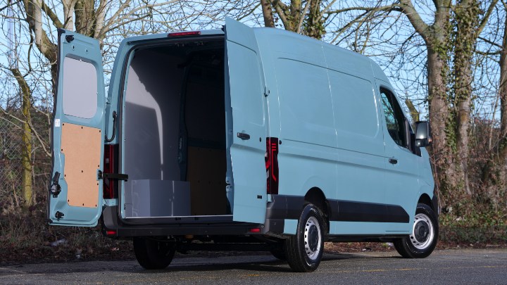 Renault Master E‑Tech electric van with rear doors open, showing empty cargo area