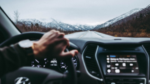 Car Driving In Mountain Range