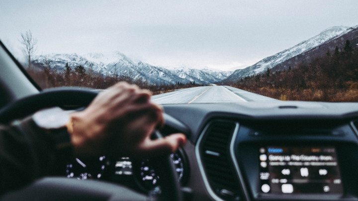 Car Driving In Mountain Range