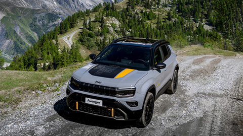 Grey Jeep Avenger 4XE Exterior Front Driving Mountain Track