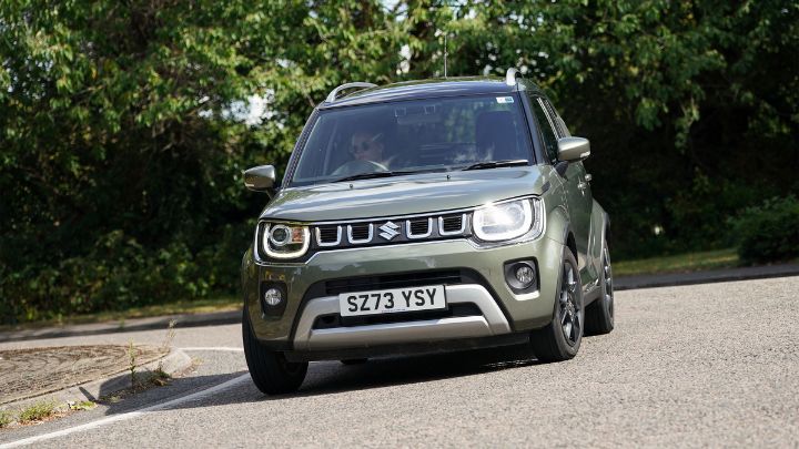 Grey Suzuki Ignes driving on the road