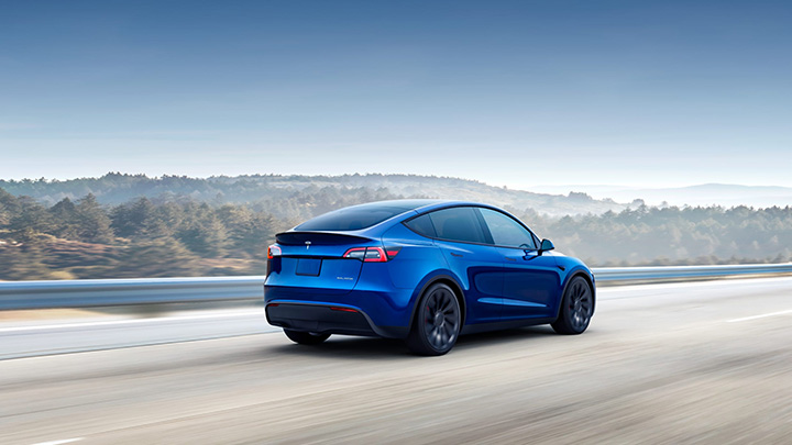 Blue Tesla Model X Exterior Rear Driving Desert