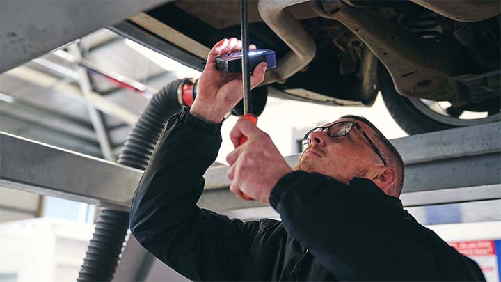 technician performing vehicle health check