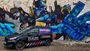 ford van parked in front of optimus prime graffiti