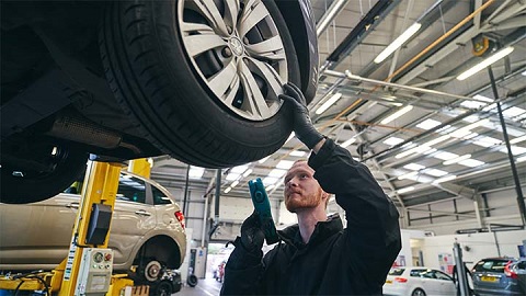 technician inspecting health of vehicle tyre