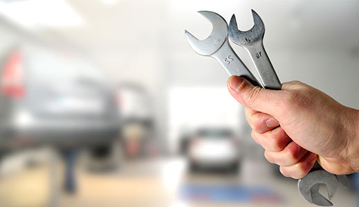 Spanners and cars in a workshop