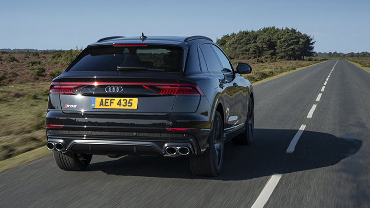 Audi Q8 driving rear shot