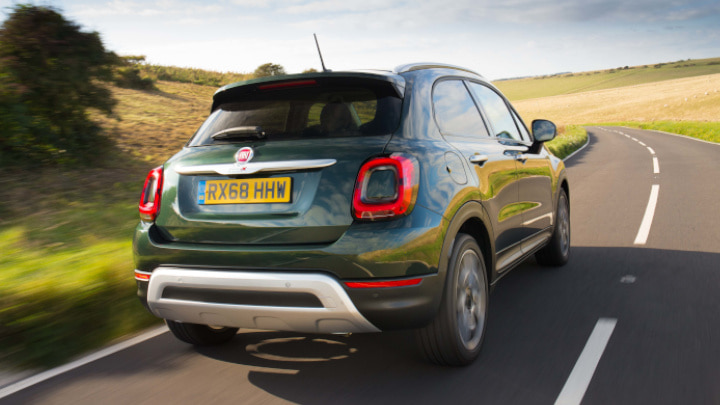 Green Fiat 500X Driving Rear