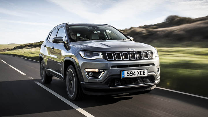 Grey Jeep Compass, driving in the countryside
