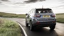 Grey Jeep Compass, driving in the countryside, rear shot
