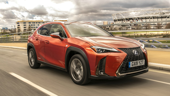 Orange Lexus UX Exterior Front Driving