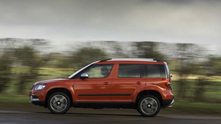 Orange Skoda Yeti Driving Sideview