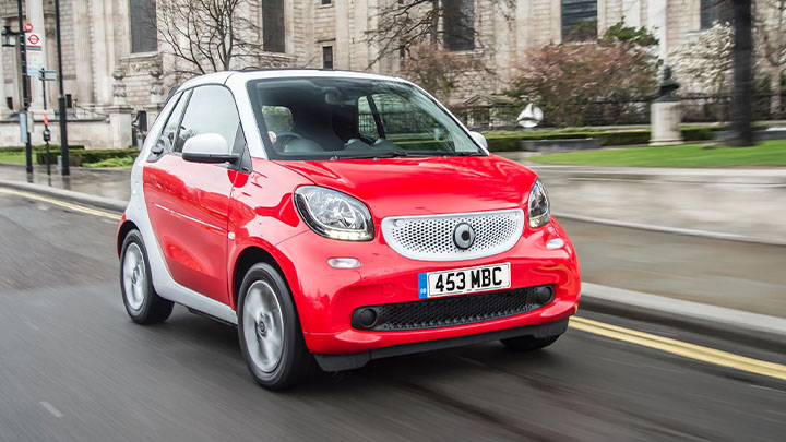 Red Smart ForTwo driving