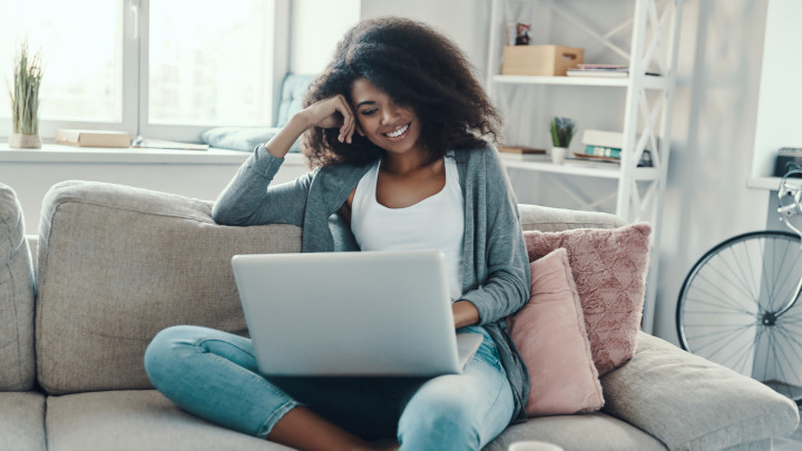 Woman on Laptop Smiling