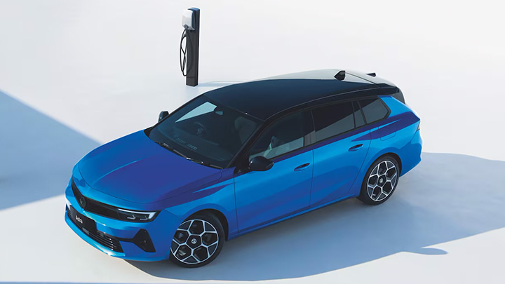 Blue Vauxhall Astra Sports Tourer Next to Charger