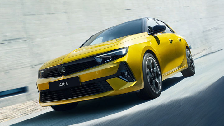 Yellow Vauxhall Astra Front Driving