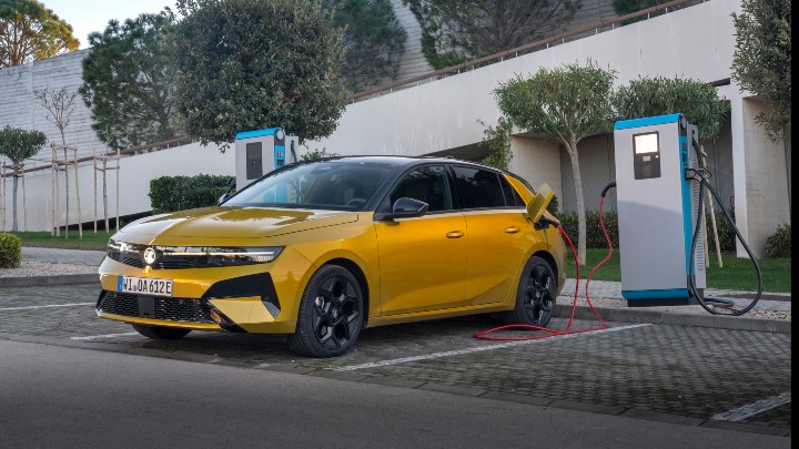 Yellow Vauxhall Astra Charging
