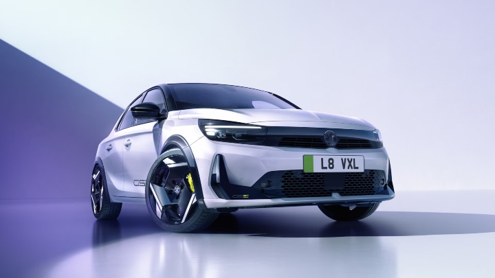Front three-quarter view of a Vauxhall Corsa GSE in a studio setting with aerodynamic alloy wheels