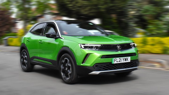 Green Vauxhall Mokka, front quarter, driving