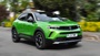 Green Vauxhall Mokka, front quarter, driving