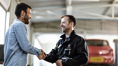 Vauxhall technician greeting customer