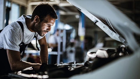 Vauxhall technician looking under car bonnet