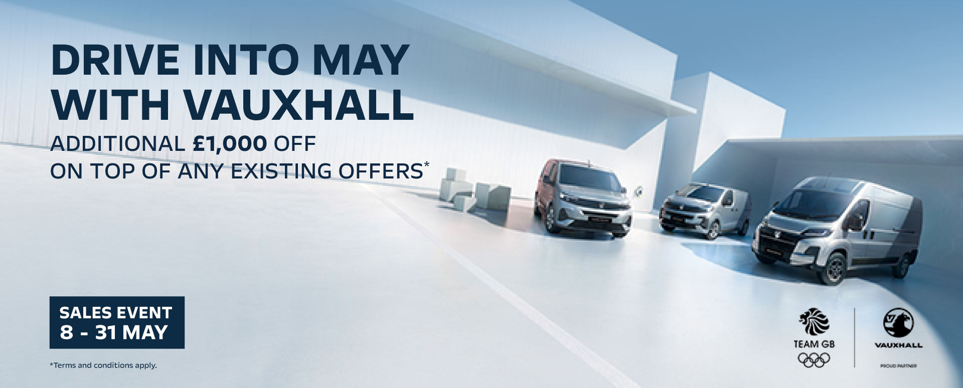 Three Vauxhall Vans Parked With Promotional Messaging