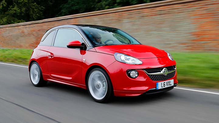 red vauxhall adam driving