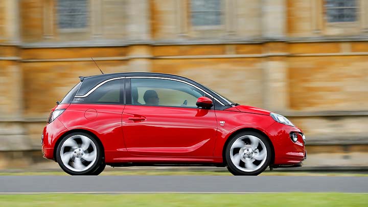 red vauxhall adam driving