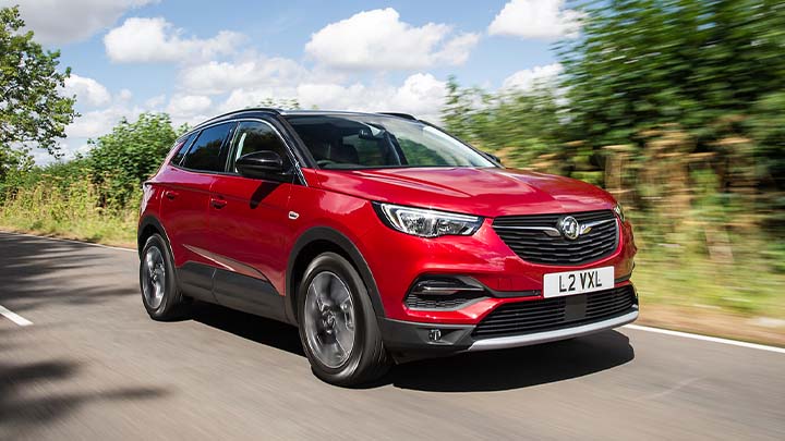 red vauxhall grandland x, driving in countryside