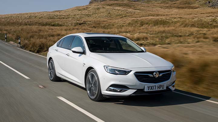 white vauxhall insignia driving