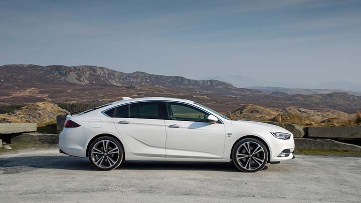 white vauxhall insignia, side shot