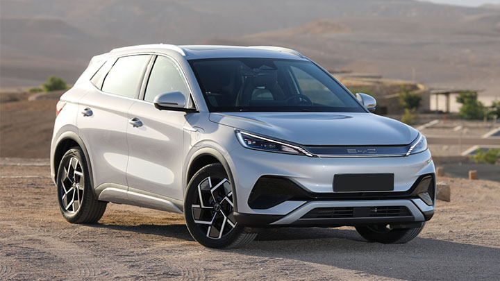 Silver BYD ATTO 3  parked on the outskirts of a desert