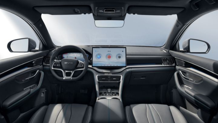 Inside of a cabin of a BYD Seal U DM-i. The seats have black leather covers.