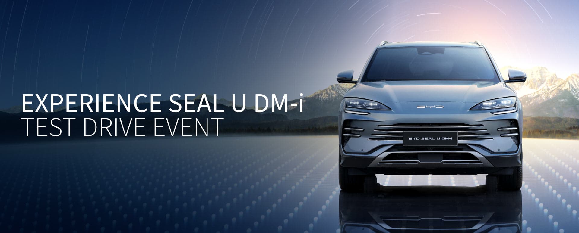Silver BYD SEAL U DM-i parked on a reflexive floor with mountains in the background